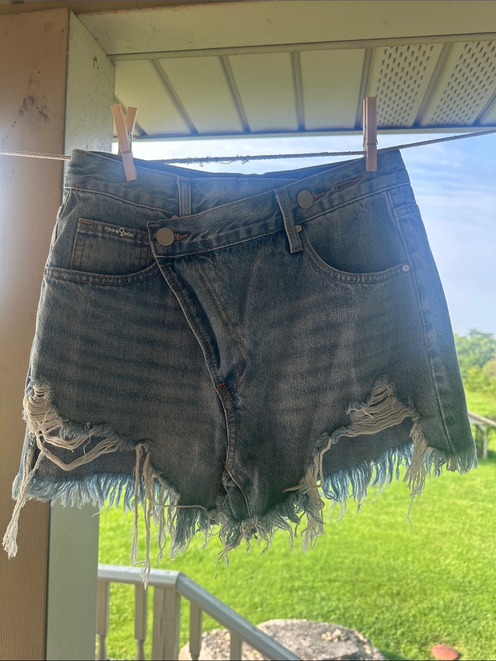 Women’s Distressed Denim Cutoff Shorts - Light Blue